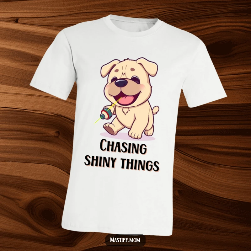 Funny Kawaii Mastiff t-shirt depicting a happy, panting dog with intense focus, hilariously chasing a small red laser pointer dot.
